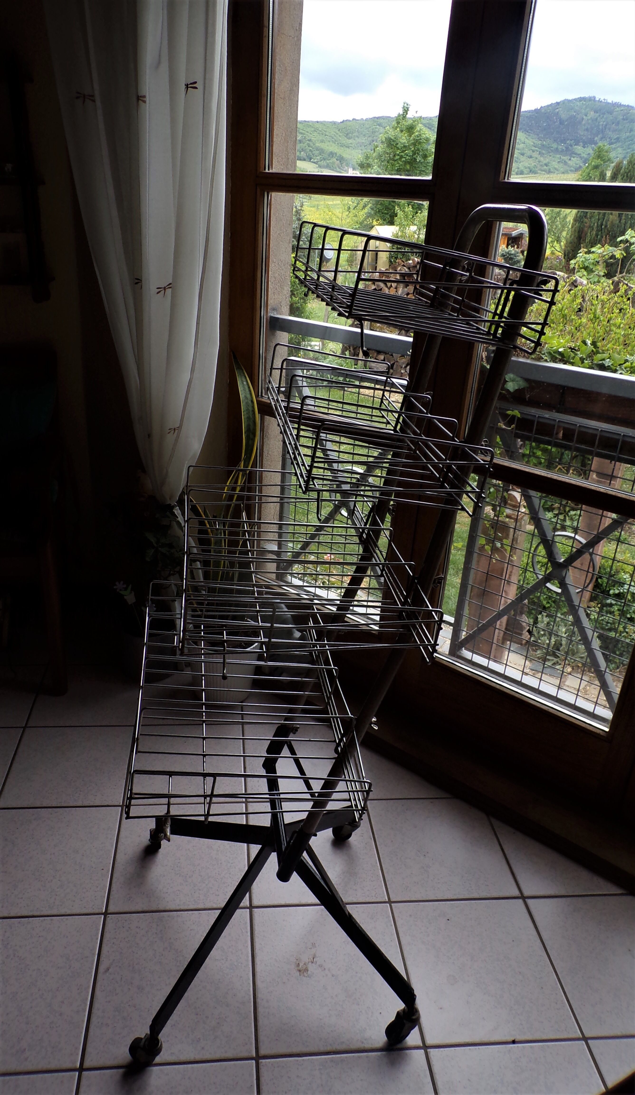 Metal grocery shelf on wheels