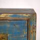 Old wooden entrance buffet in blue and yellow tones (circa 1920).