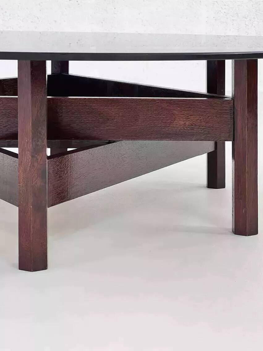 Wooden coffee table with round smoked glass top