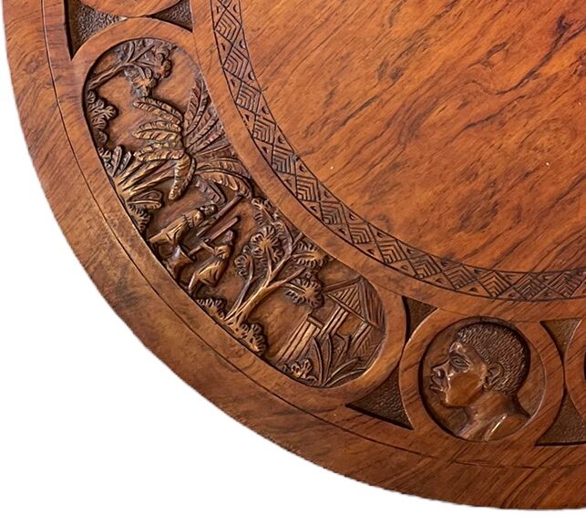 Circular tripod coffee table in carved wood