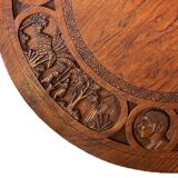 Circular tripod coffee table in carved wood