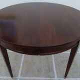 Round mahogany table with mahogany veneer and brass sabot foot.