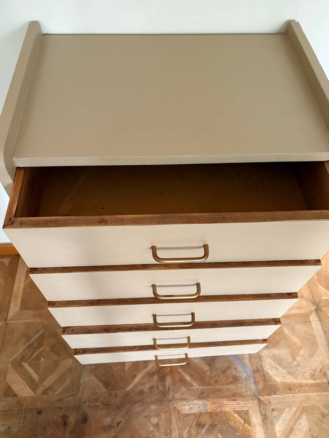 Mocha compass foot chest of drawers