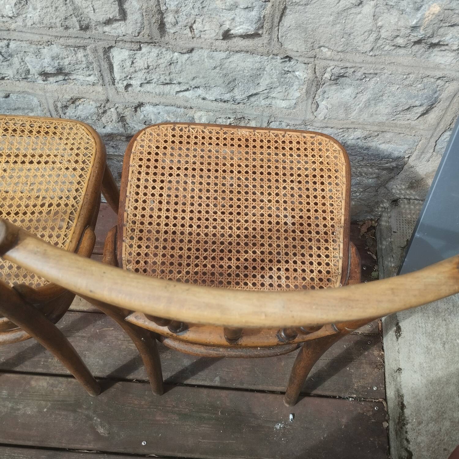 Set of 2 antique bistro chairs. Curved and turned wood.