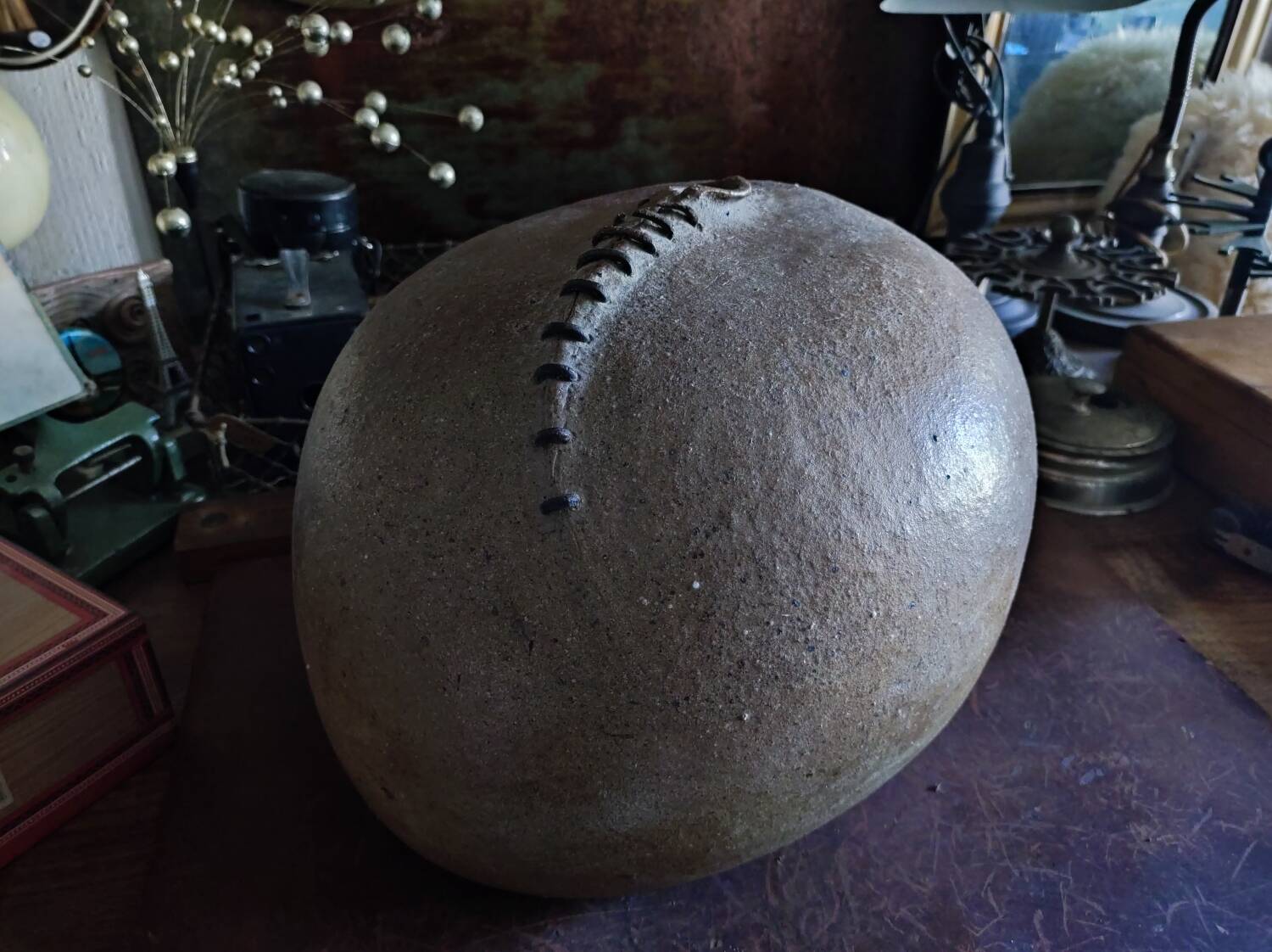 Vintage sandstone vase, in the shape of a rugby ball, signed