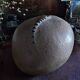 Vintage sandstone vase, in the shape of a rugby ball, signed