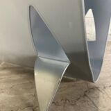 Designer log holder in enameled sheet metal