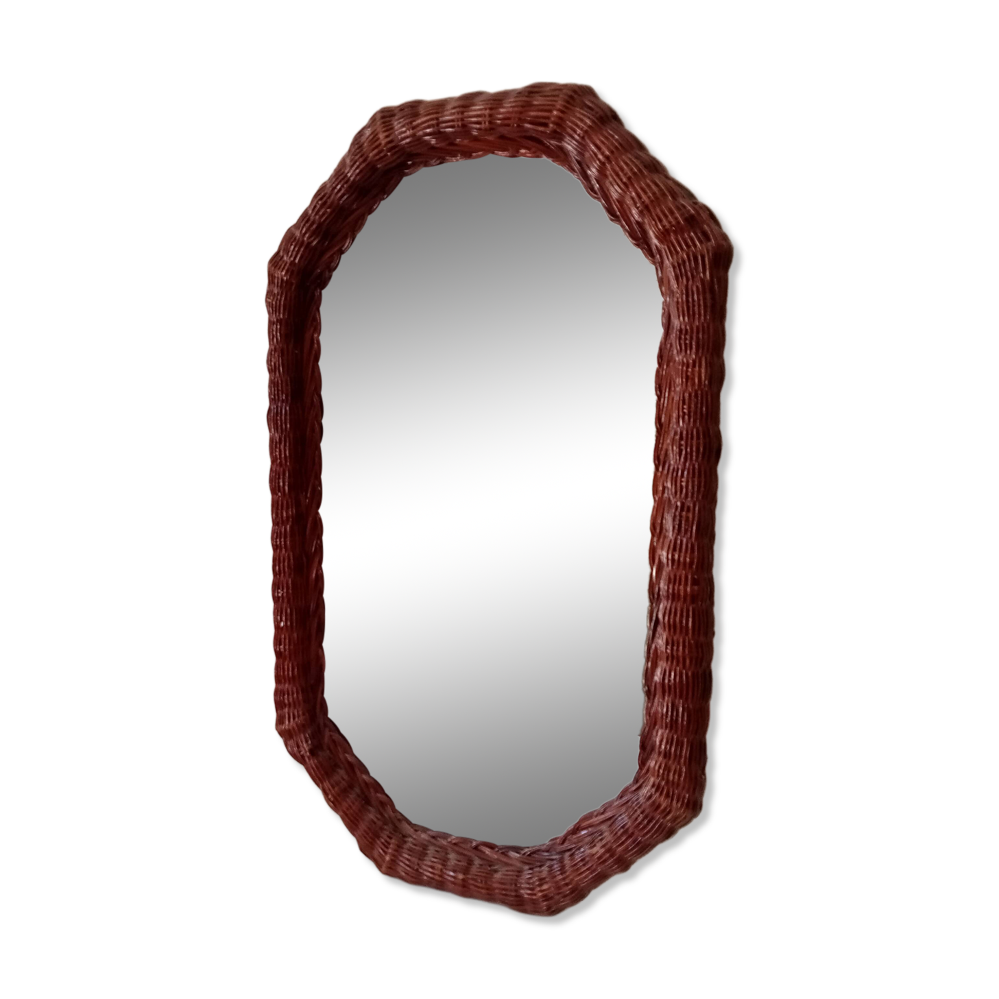Vintage octagonal mirror in woven rattan.