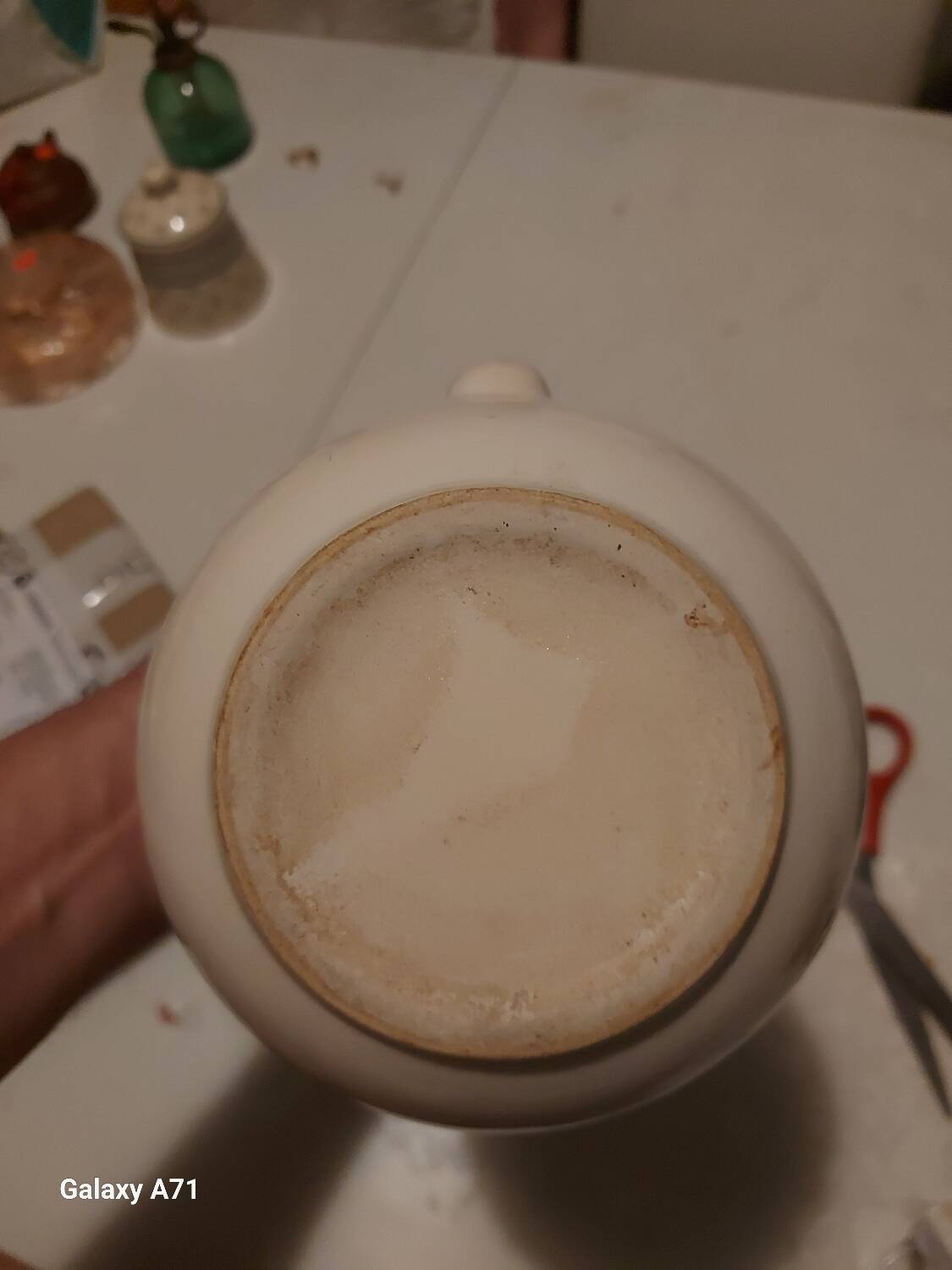 Earthenware pitcher with floral motifs in the Moustiers style, signed.