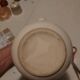 Earthenware pitcher with floral motifs in the Moustiers style, signed.