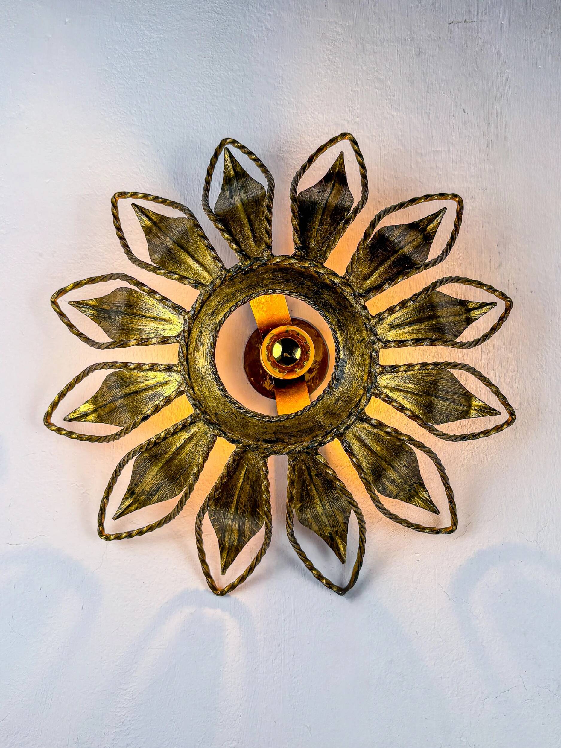 Sunburst ceiling light fixture or sconce, gilt iron & exposed bulb France, 1970s