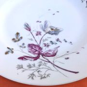 Antique white porcelain shallow dish with floral decoration.