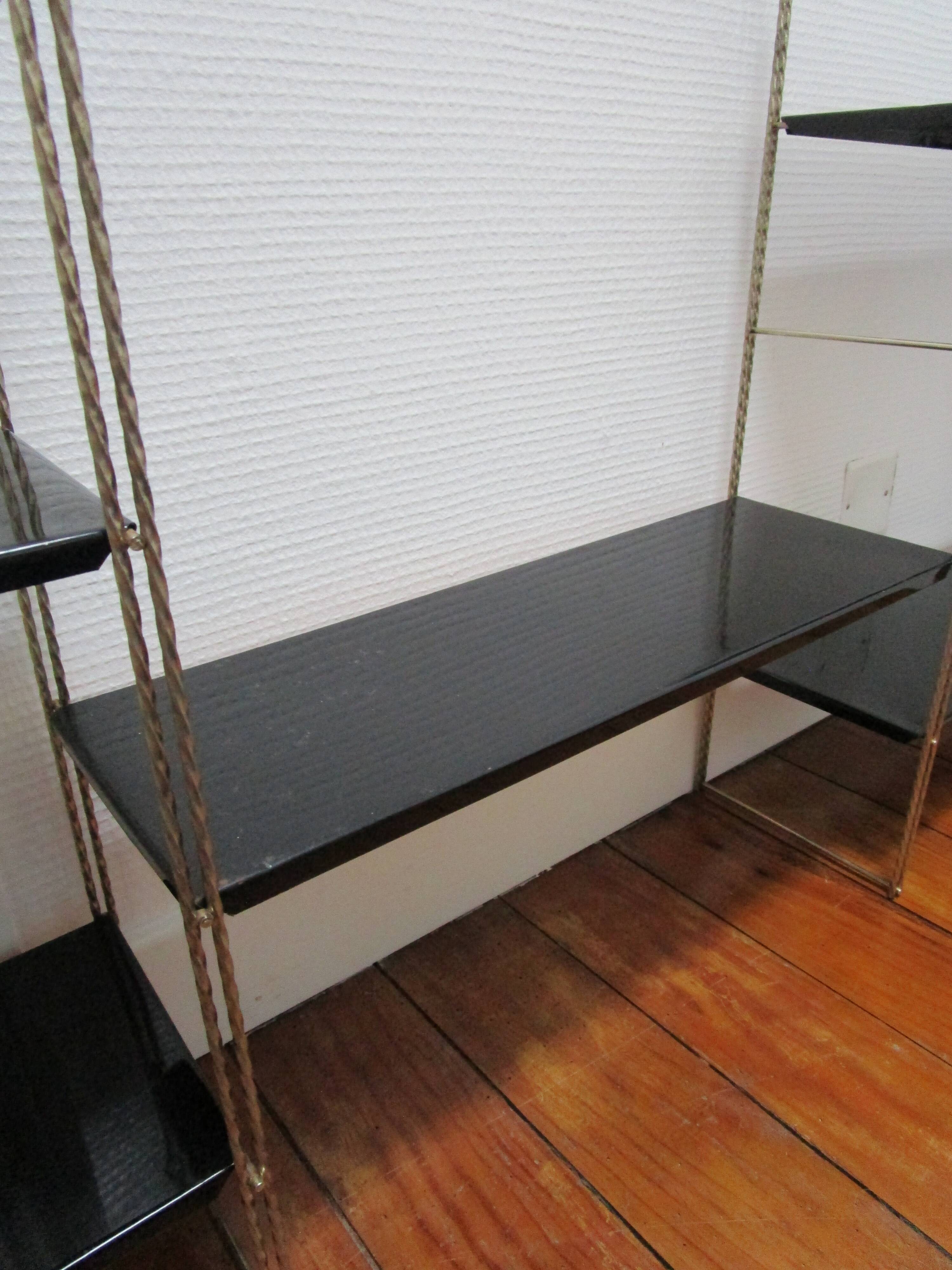 Black and gold metal tomado wall shelf