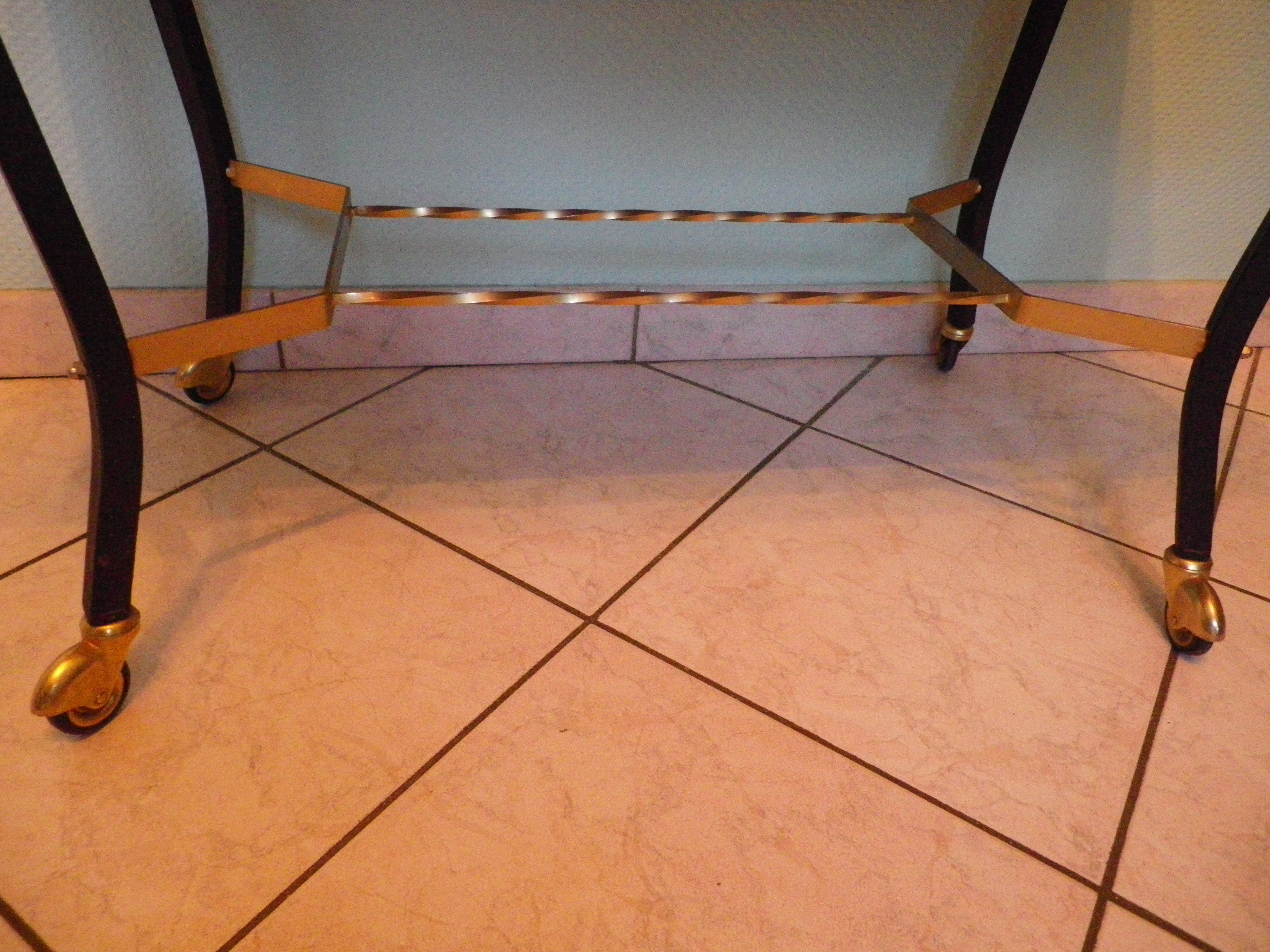 Lounge table, side table on wheels, formica top, gold and black metal