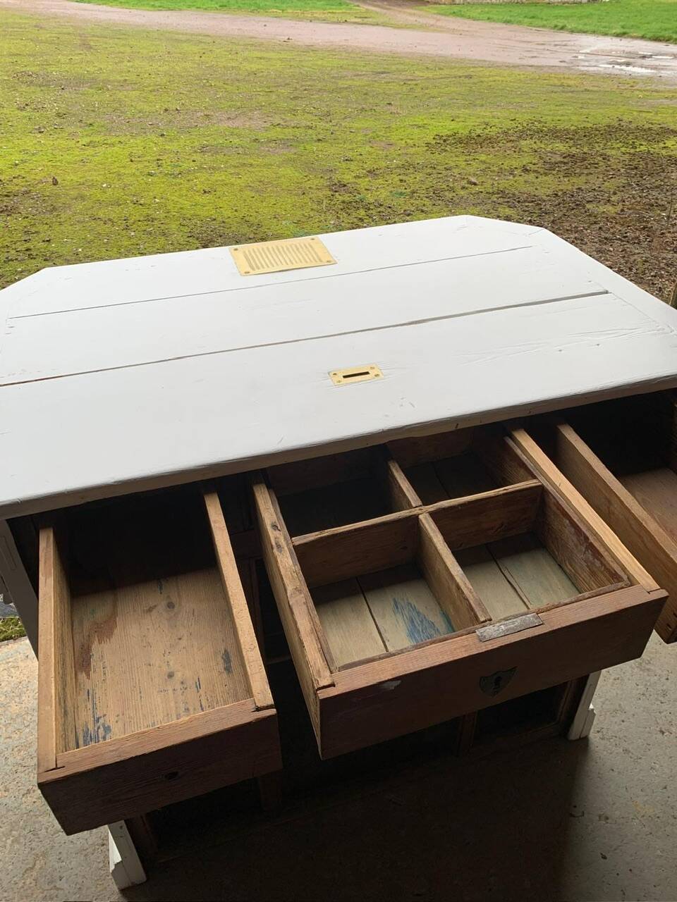 White counter with brass coin mechanism
