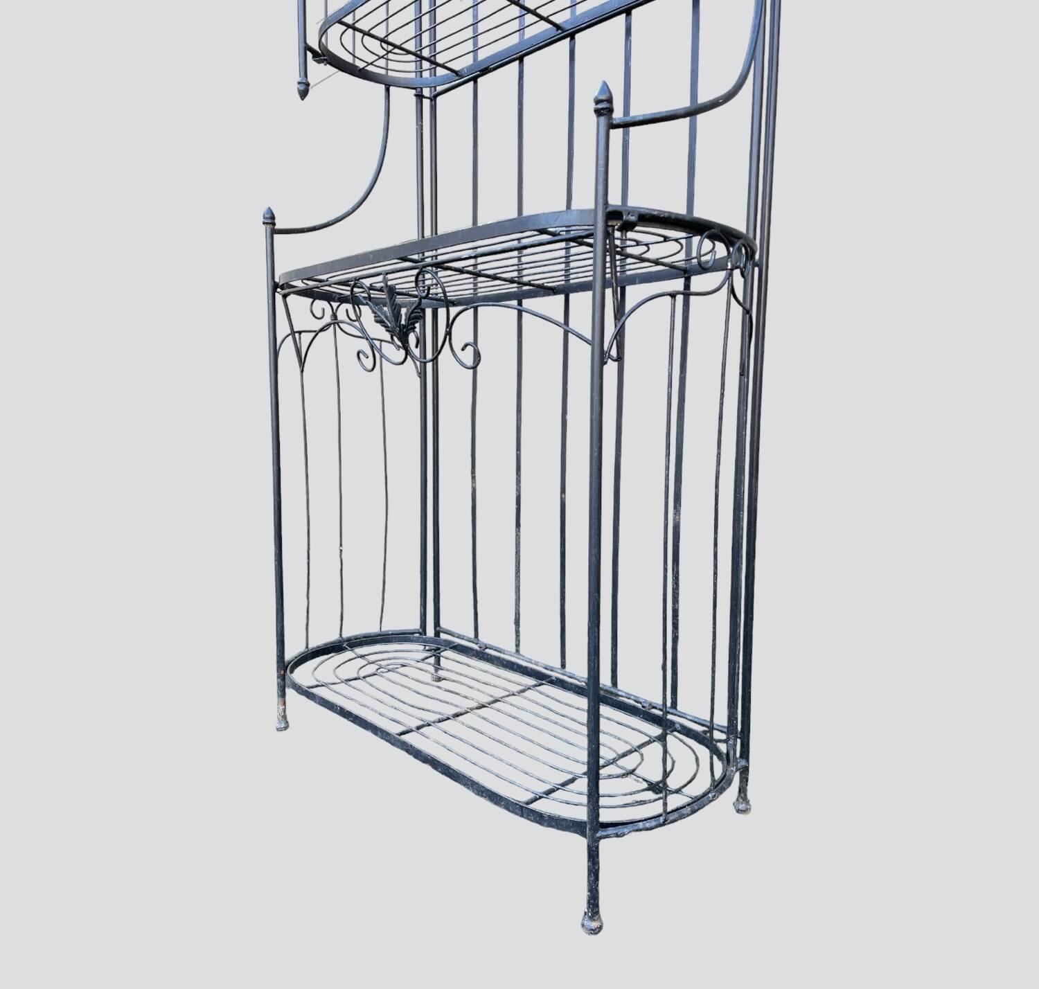 Old wrought iron garden shelf for plants