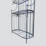 Old wrought iron garden shelf for plants