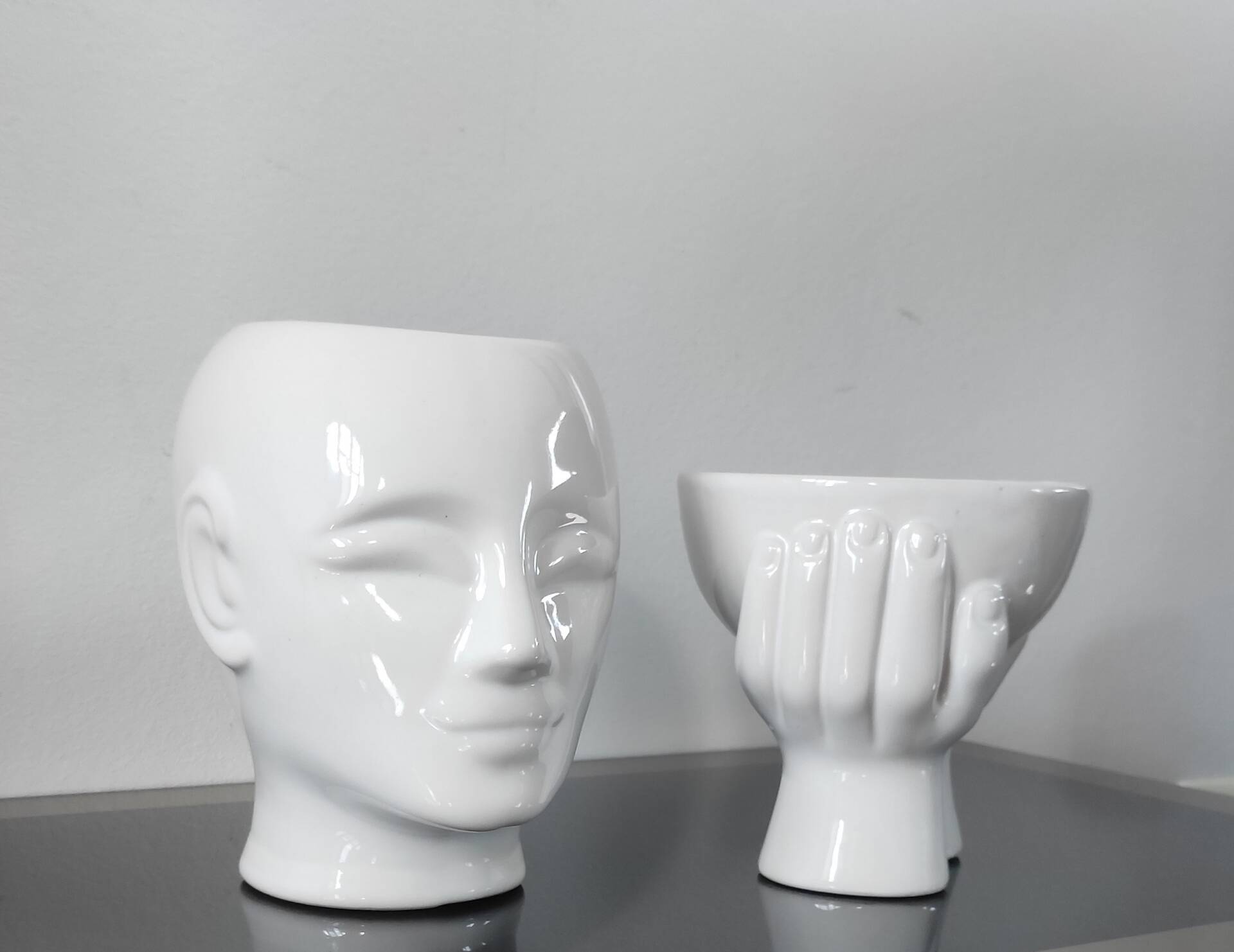 A pair of vintage ceramic plant pots.