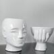 A pair of vintage ceramic plant pots.