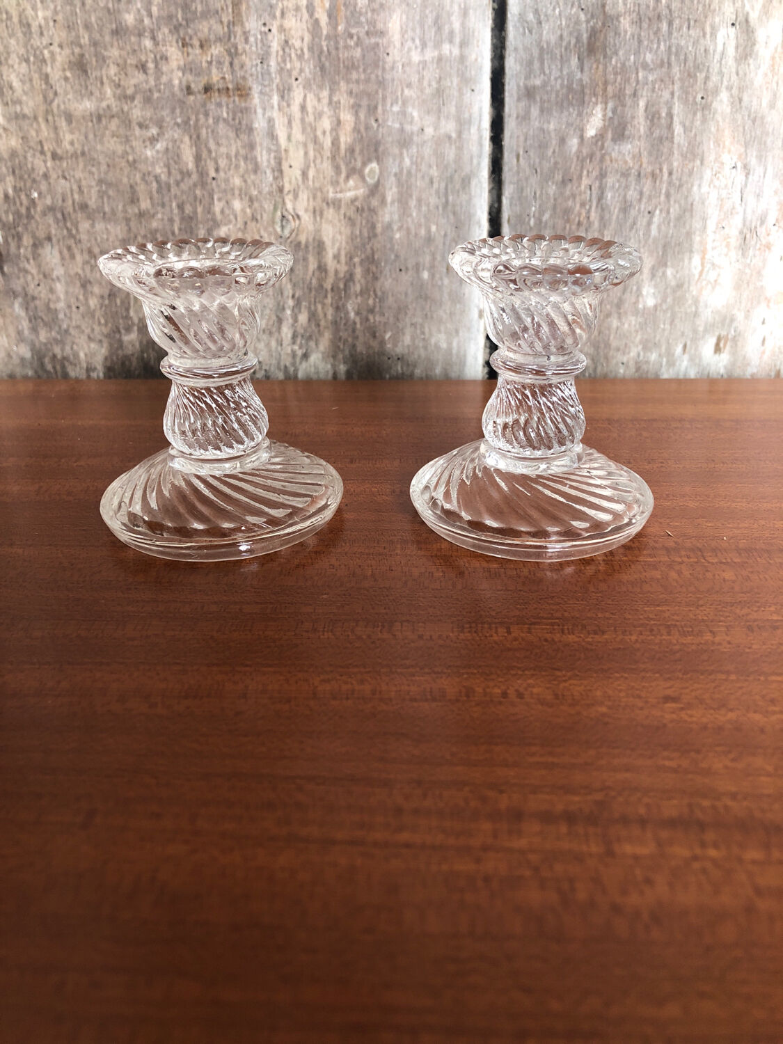 Old pair of vintage round molded glass candle holder