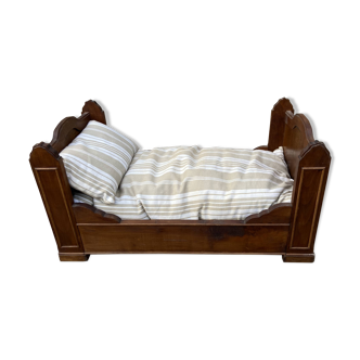 Old wooden doll's bed