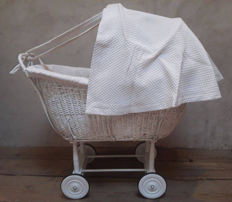 Wicker and painted wood baby cradle
