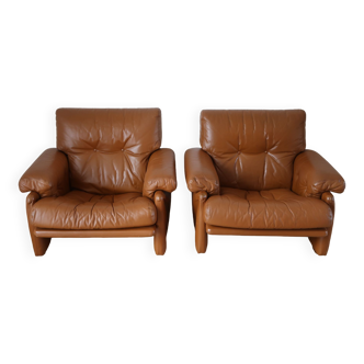 Pair of vintage brown leather armchairs