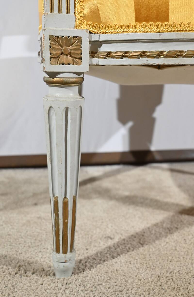 Pair of Cabriolet Armchairs, in rechampi wood, Louis XVI style – Late 19th century