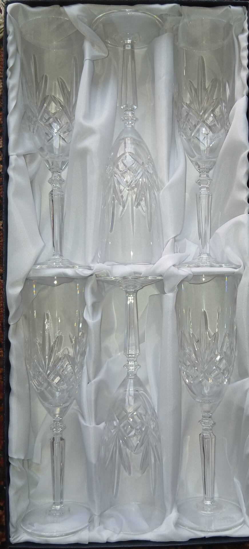 6 crystal champagne flutes from Lorraine Walsheid in their case.