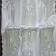 6 crystal champagne flutes from Lorraine Walsheid in their case.