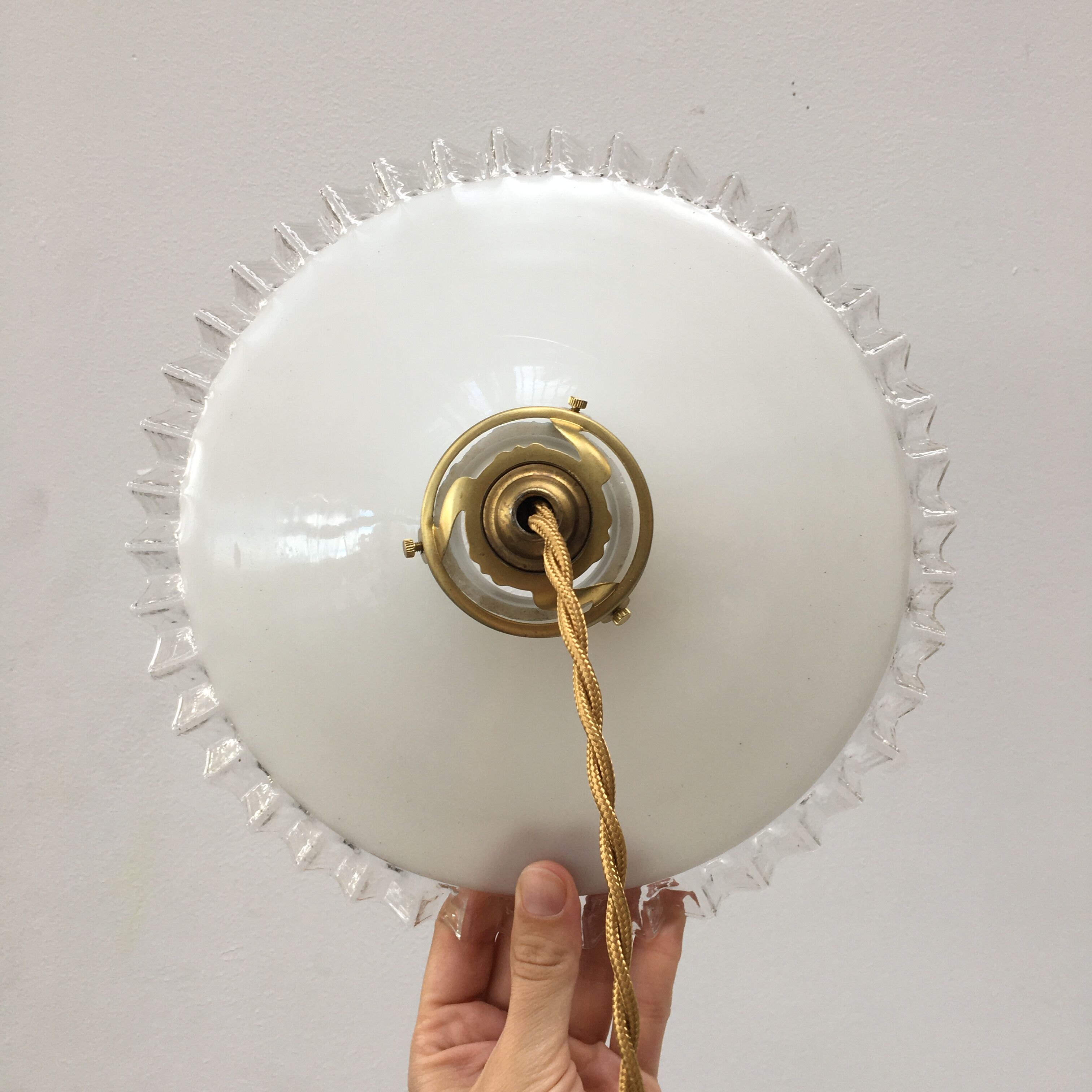 Pair of white opaline suspensions with serrated edges