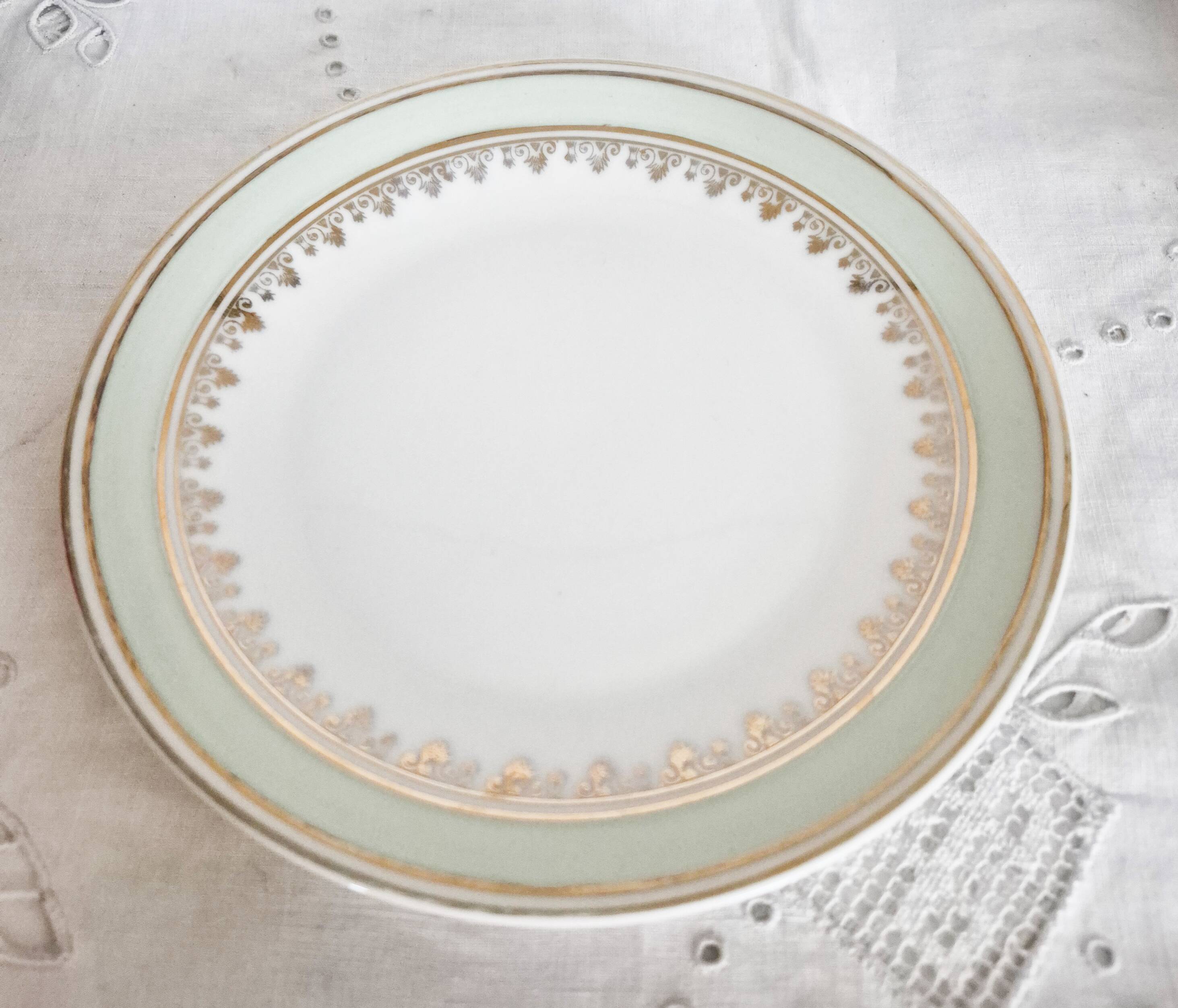 French porcelain dessert plates, green and gold.
