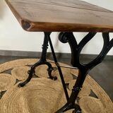 Bistro table with iron legs and raw wood top