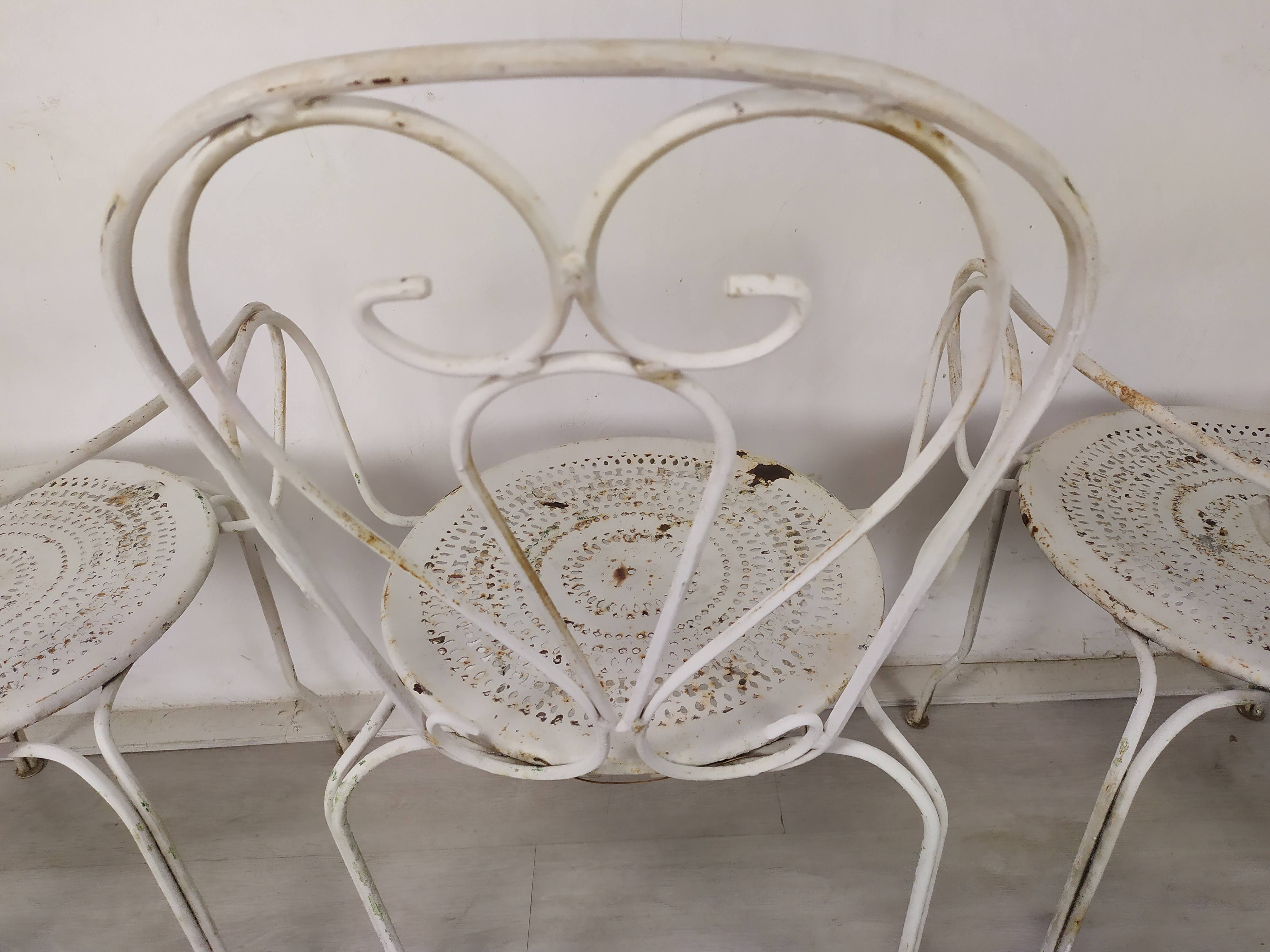 4 wrought iron garden armchairs