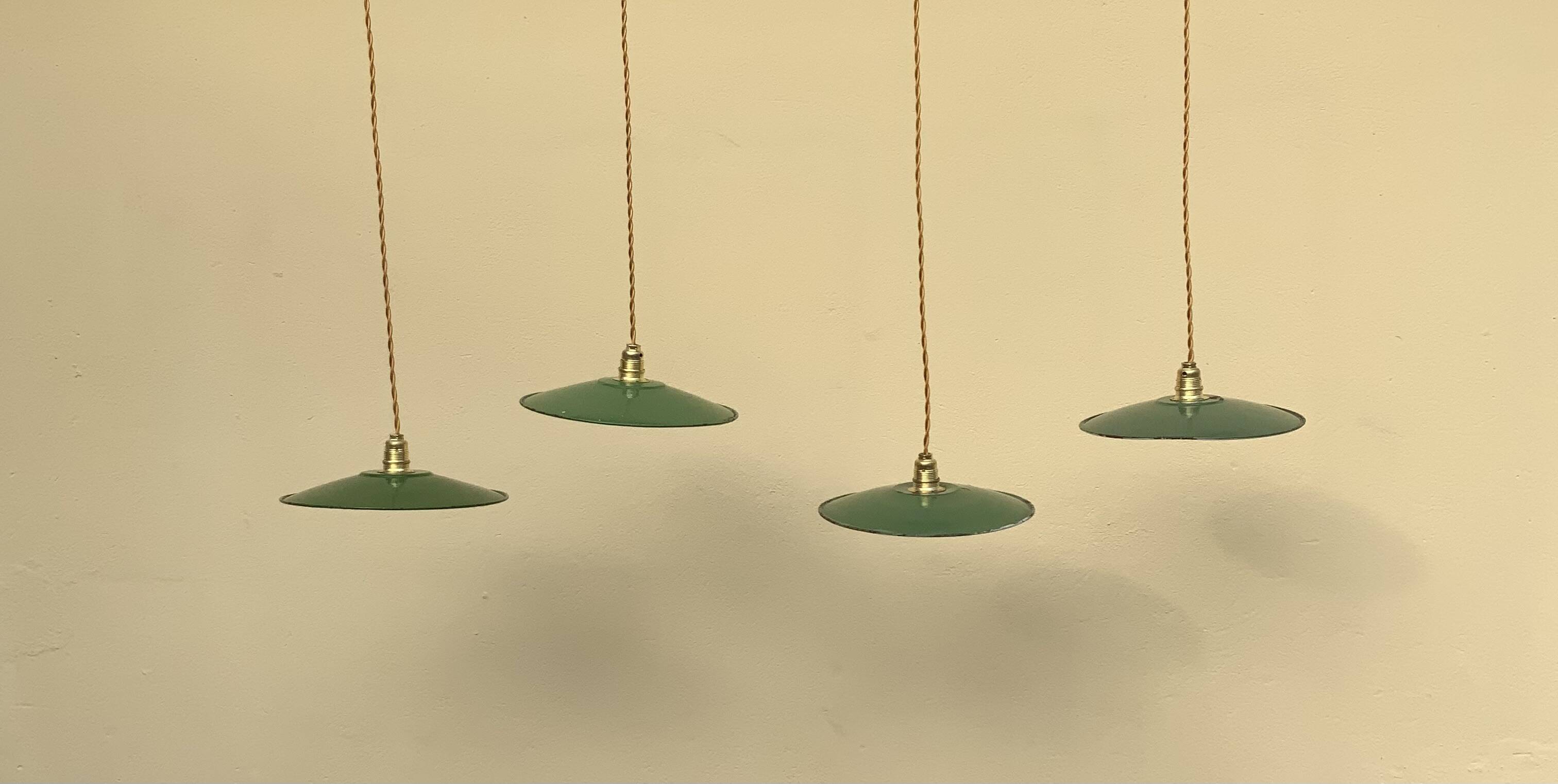 Vintage industrial enameled sheet metal pendant lights with golden wires, old green and white lampshade
