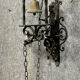 Wrought iron entrance bell depicting a monk ringing a bell circa 1900-1930