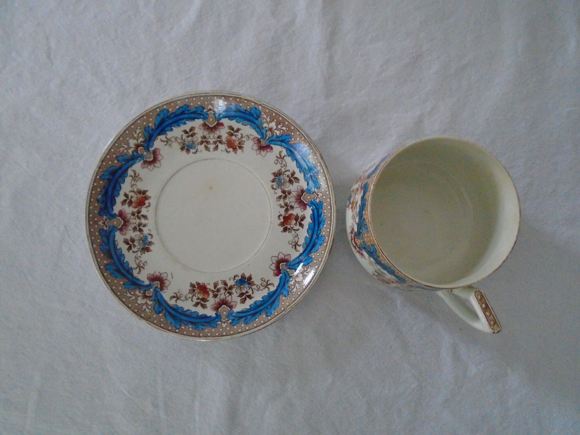 Cup and saucer floral décor faience fine BFK Boch Brothers Keramis old