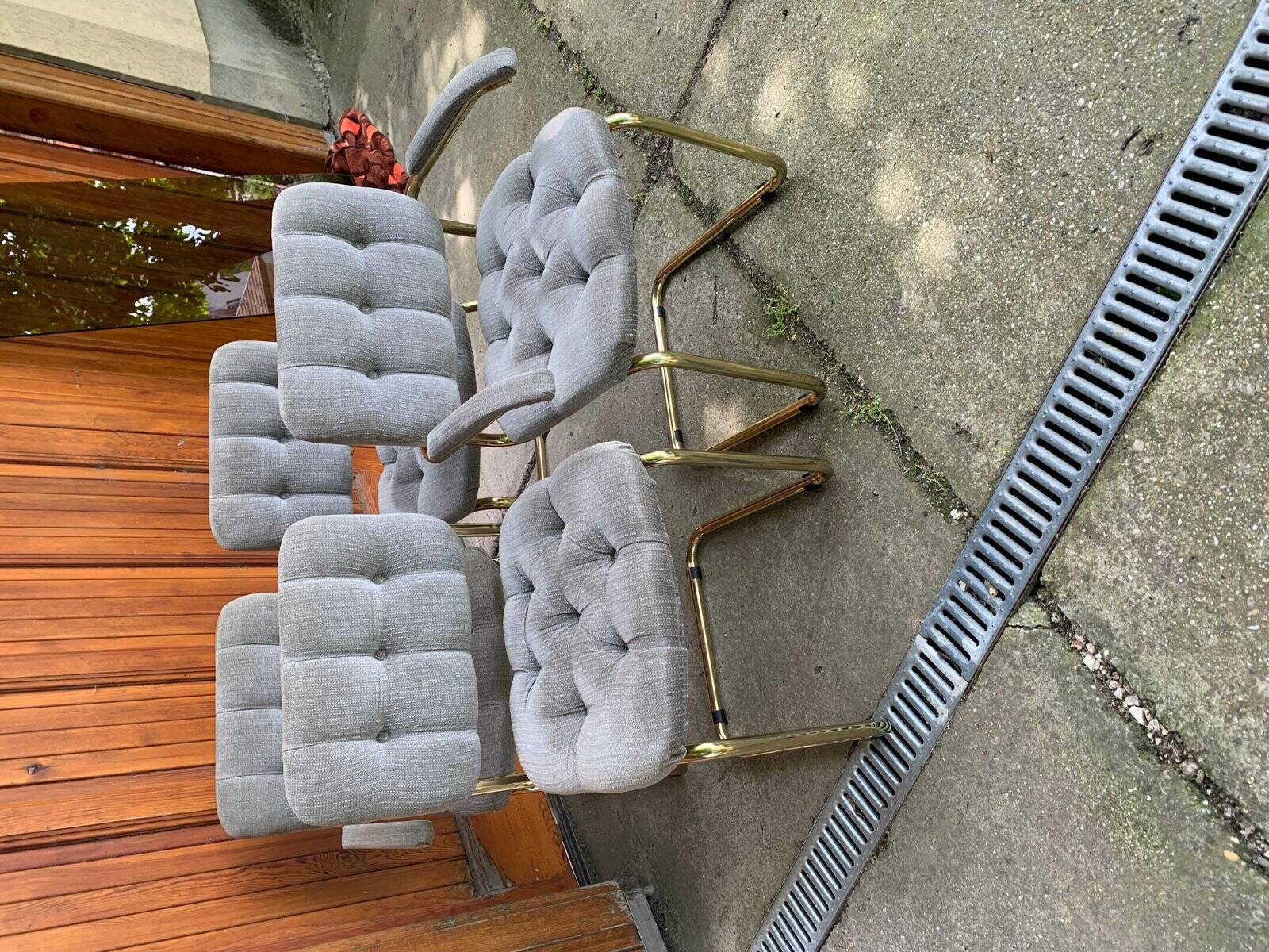 1970s table set with 4 chairs in gold brass and grey fabric, smoked glass top.