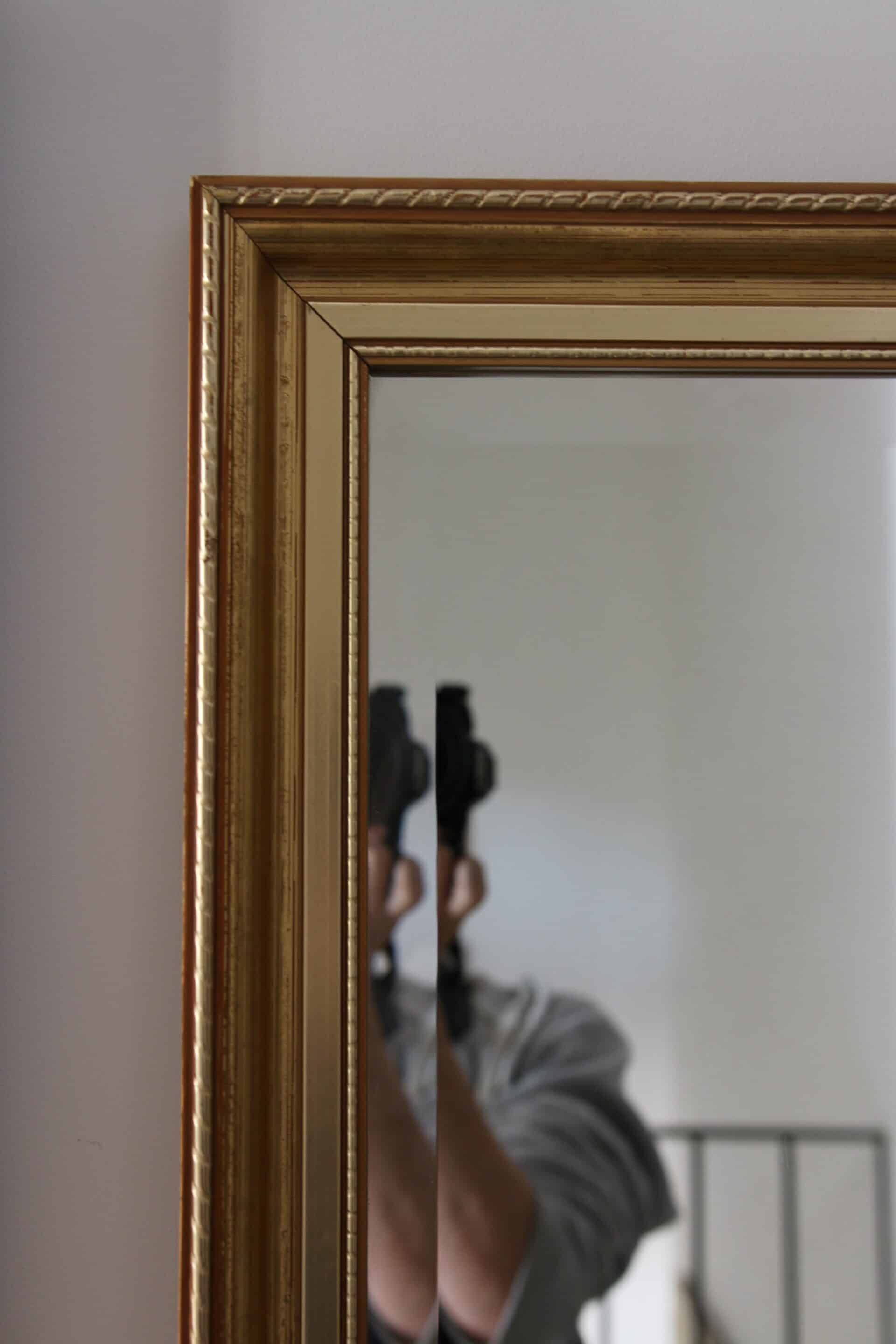 Large beveled mirror in carved wood