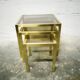Trio of nesting tables in brass and smoked glass