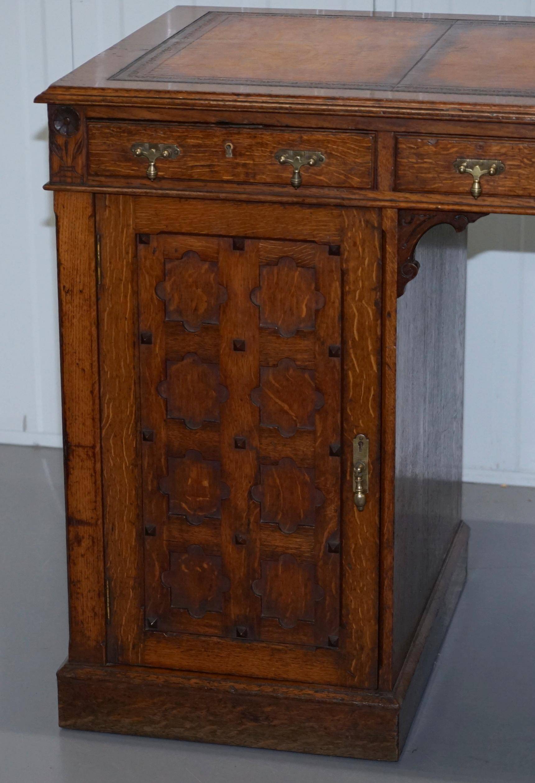 Restored Gothic desk with side bookshelves, drawer, and sloping top by Pugin Gillows.