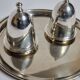 Deux coquetiers sous cloche en métal argenté avec plateau de présentation "Gombault", 28 cm