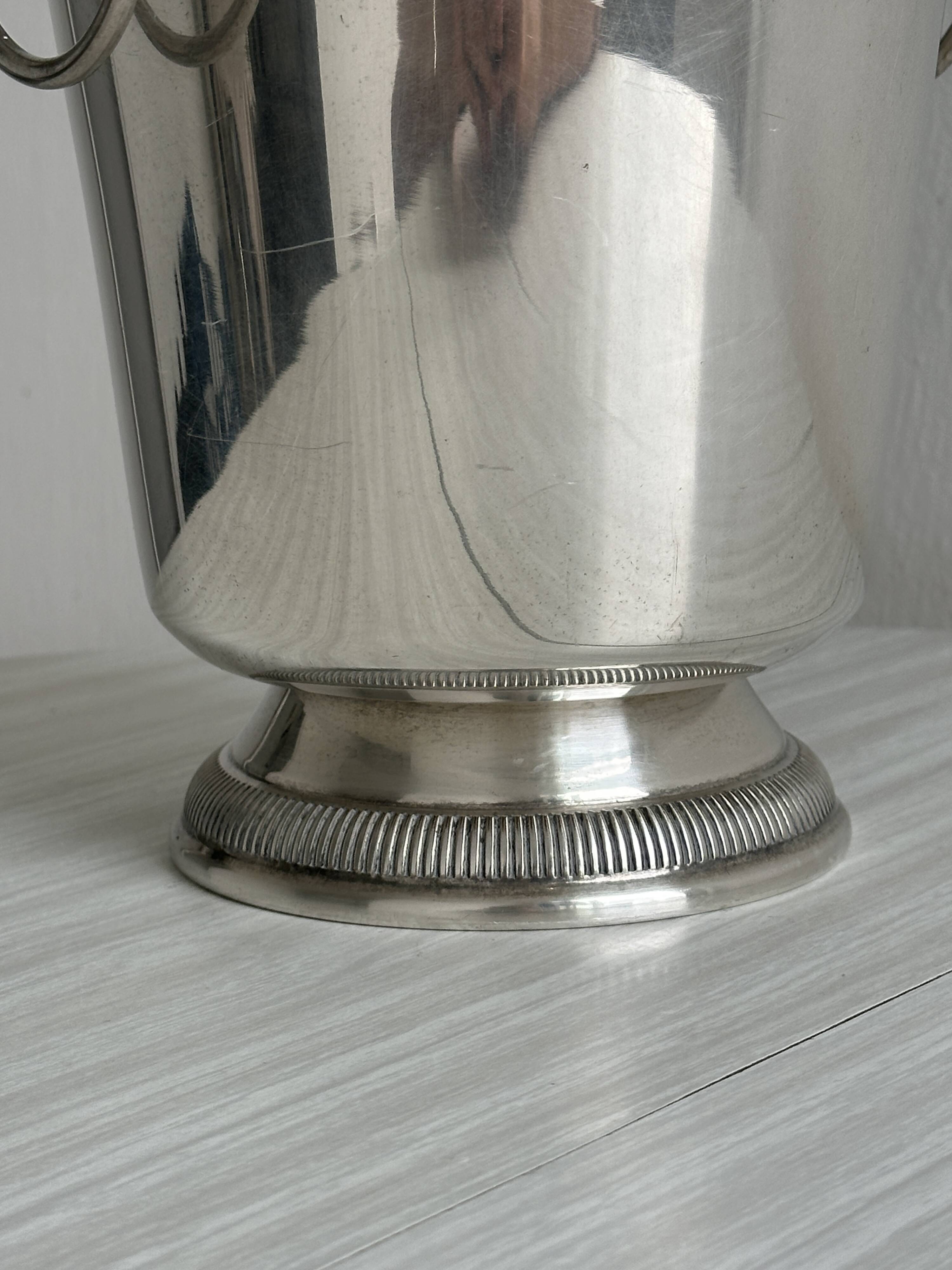 Antique champagne bucket in shiny silver metal
