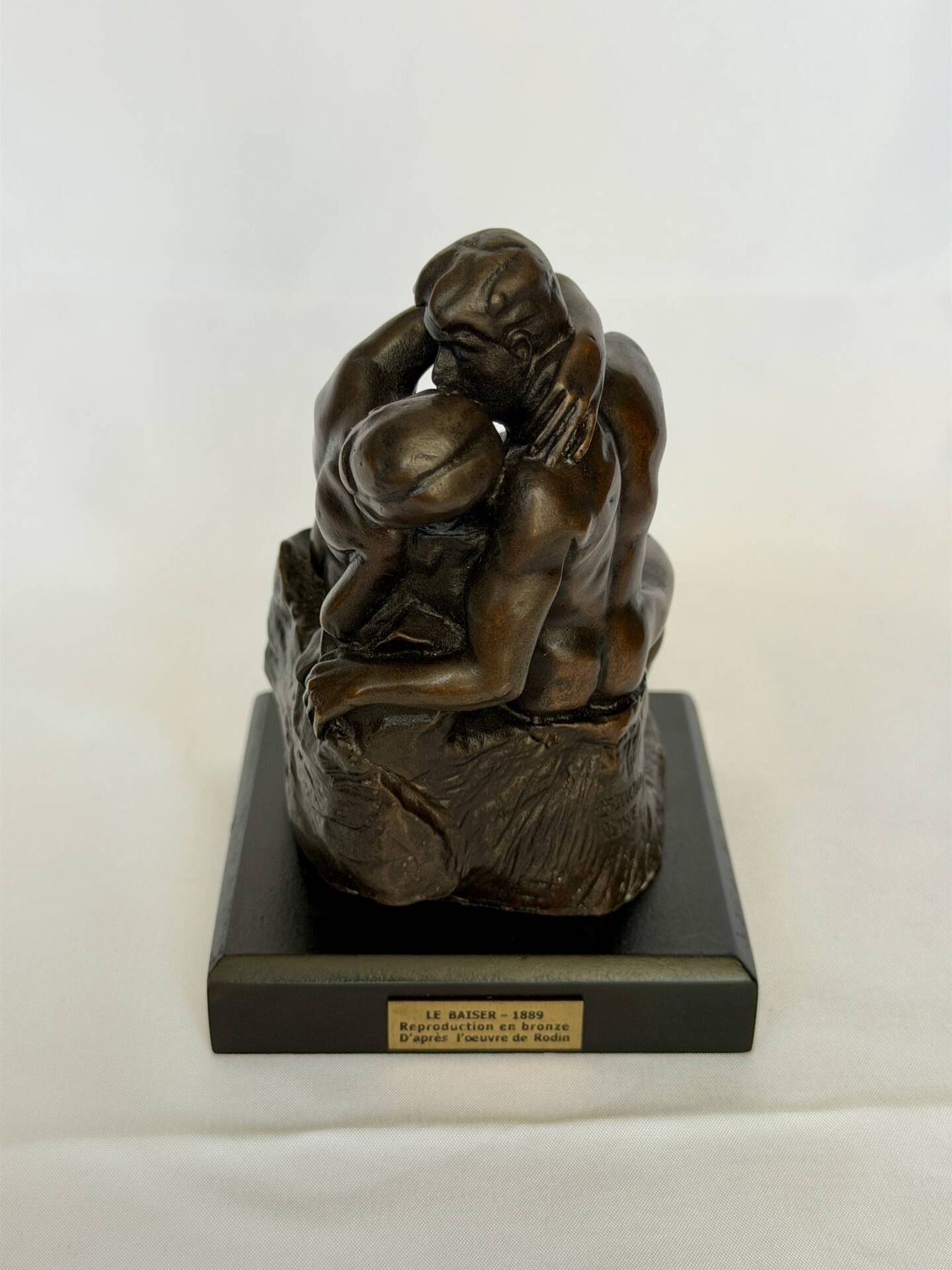 The bronze sculpture The Kiss, a reproduction of Rodin's statue, French sculpture.