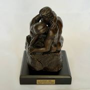 The bronze sculpture The Kiss, a reproduction of Rodin's statue, French sculpture.