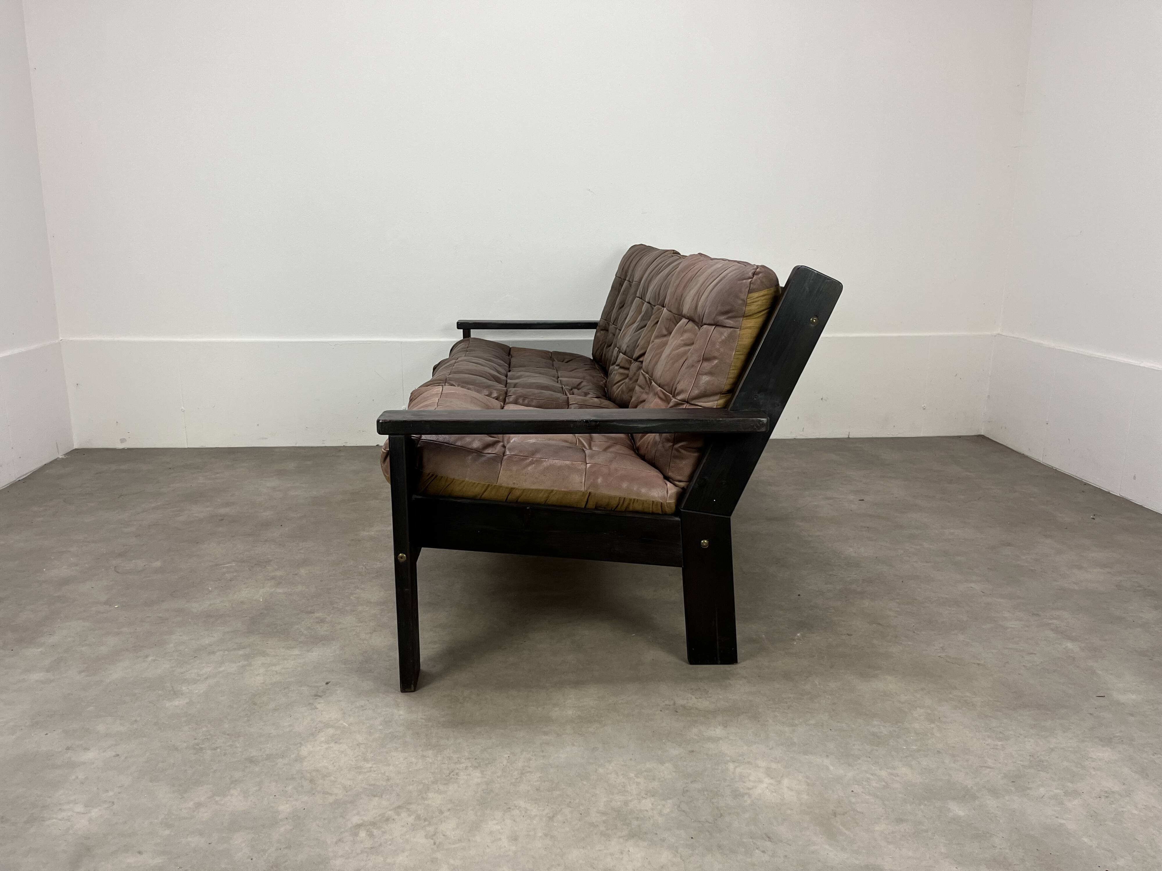 Living room sofa and brutalist armchairs in leather and wood, 70s, chalet style