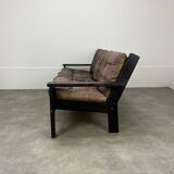 Living room sofa and brutalist armchairs in leather and wood, 70s, chalet style