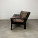 Living room sofa and brutalist armchairs in leather and wood, 70s, chalet style