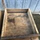 Old chestnut table with 3 front drawers and a cat bar.