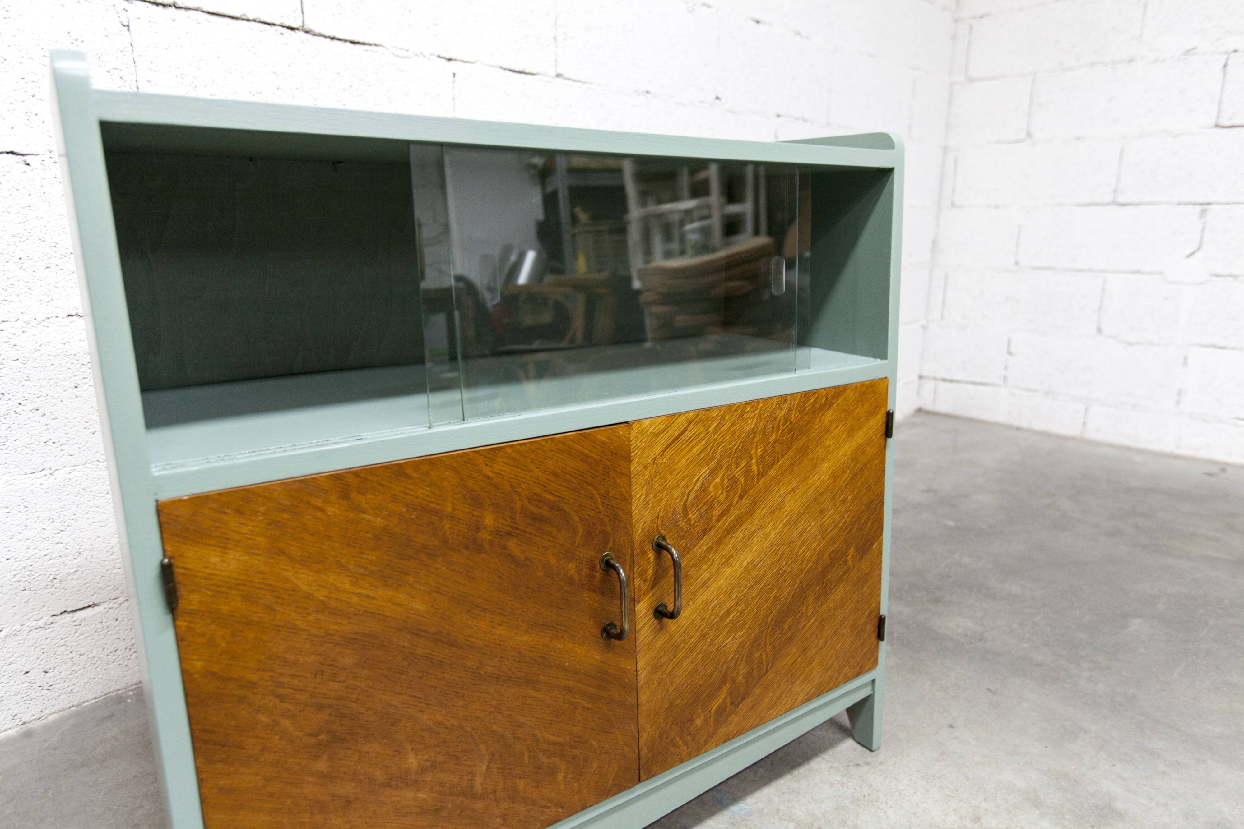 Atypical green noble 1960s low display cabinet.